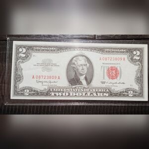 A 1963 TWO DOLLAR LEGAL TENDER NOTE,RED SEAL IN EXCELLENT CONDITION